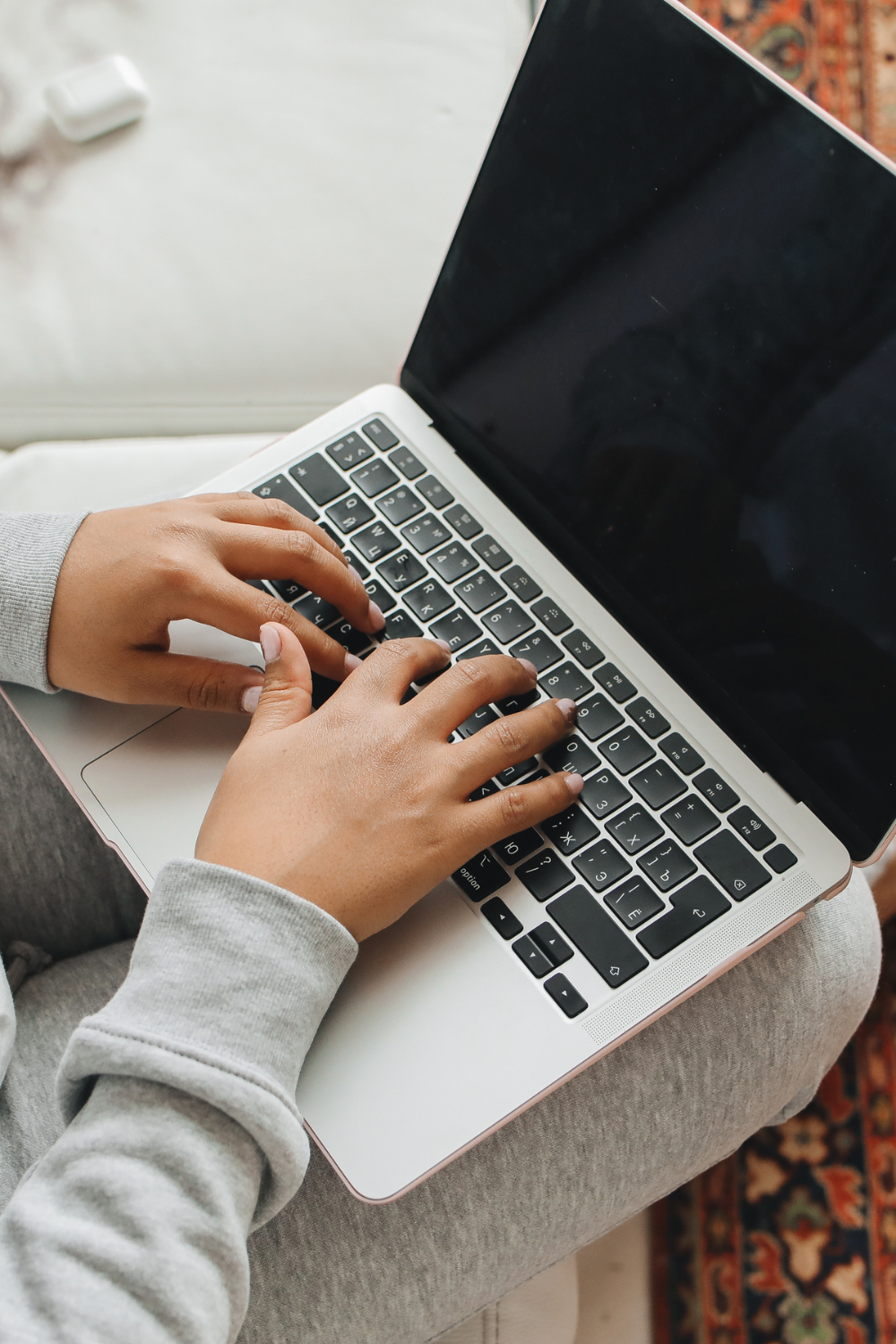 hands typing on computer